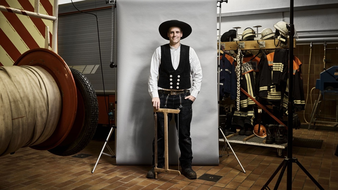 Chris in his carpenter outfit in the appliance room at the fire service.